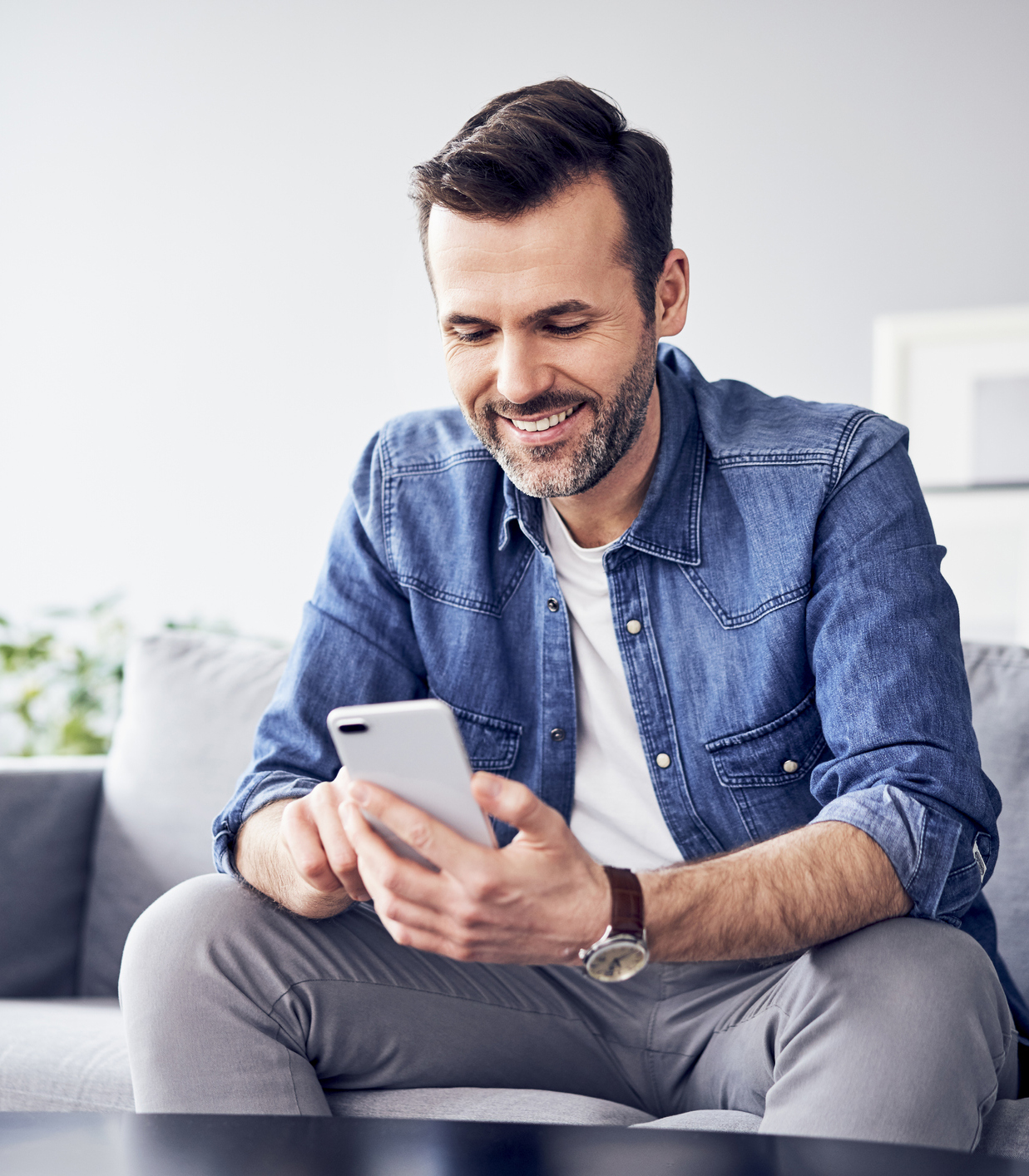 Person using a phone at home